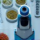 Microscope and marine samples, symbolizing research and development partnership